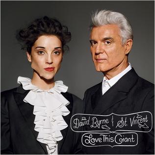 Two people in formal black jackets pose against a gray backdrop; text reads David Byrne and St. Vincent - Love This Giant by Tandem Coffee Roasters, featuring tracks such as "Who" and "Ice Age.